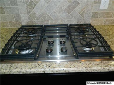 The cook in the family will love this gas cooktop. All appliances are kitchen aid