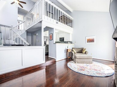 Continue into the living area with high ceilings,