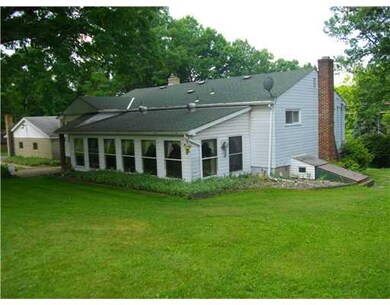 Sunroom. Back of House showing Sun Porch Addition.