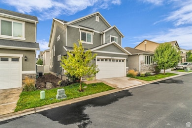 Craftsman-style home with stone siding, a garage, stucco siding, and concrete driveway