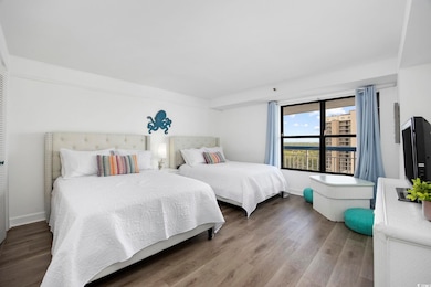 Bedroom with hardwood / wood-style flooring