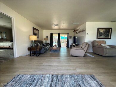 Front Entry and Front Living Area with LTV Vinyl F