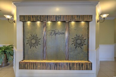Detailed view of ornamental molding, a wainscoted wall, and a decorative wall