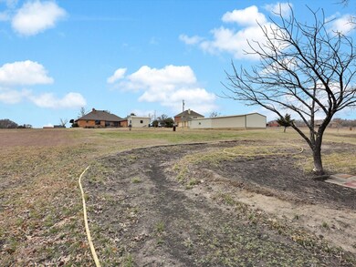 View of yard with a rural view