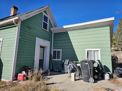 Rear view of property with a chimney