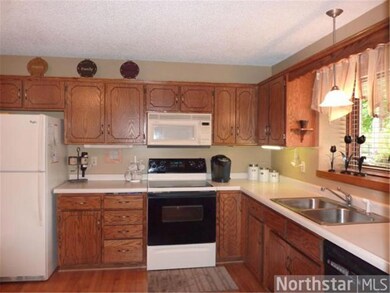 Nicely equipped kitchen is open to the foyer and d
