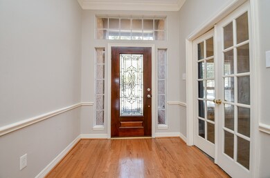 Step through the glass-paned front door and you wi