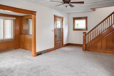 Living room with tall ceilings and gorgeous woodwo