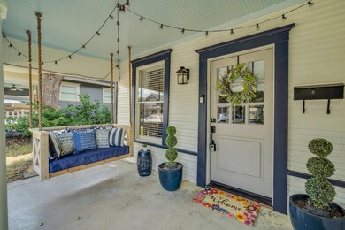 Property entrance featuring covered porch