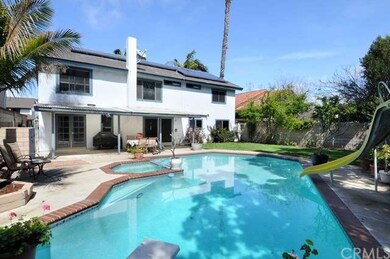 Sparkling pool with slide, custom spa in yard plus