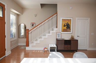 Foyer entrance with wood finished floors, baseboa