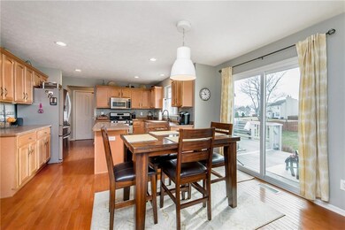Spacious kitchen with granite counter tops, stainless steel appliances that stay and a breakfast nook.
