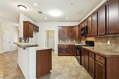 Kitchen: Tile Counters & Backsplash, Range / Oven, Dishwasher, Microwave & Disposal