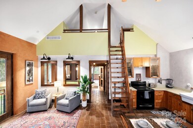 Open and Airy Living Area Underneath Vaulted Ceiling
