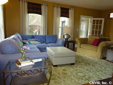 Exterior Front Custom window treatments make this 