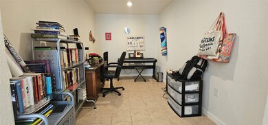 Den area can be used for an home office, study, or
