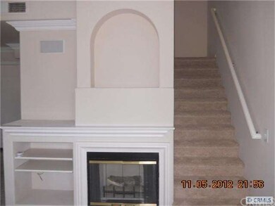 Fireplace, stairs to bedrooms