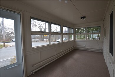 Exterior front with heated porch overlooking water