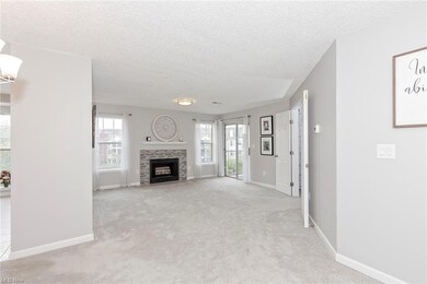Unfurnished living room featuring light colored ca