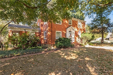 You'll love relaxing on the sweet covered porch off of the office on the left.