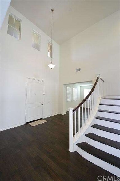Rich wood flooring, high ceiling
