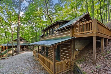 Rear view of property with a wooden deck and metal roof