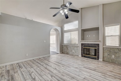Unfurnished living room featuring a fireplace, a c