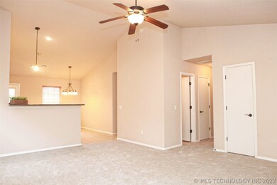 Great room opens to the kitchen with counter heigh