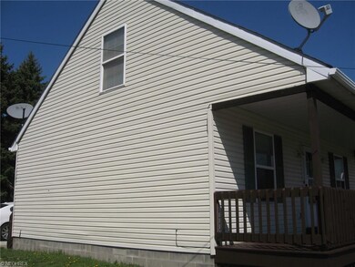 SIDE VIEW OF HOME SHOWING A SHADOWED VIEW OF PART 