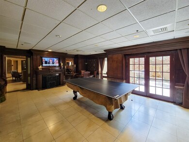 The game room - TV, ping pong, lovely patio throug