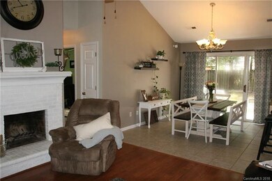 The painted masonry wood burning fireplace adds a 