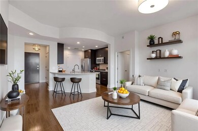 Living room with dark wood finished floors, recess