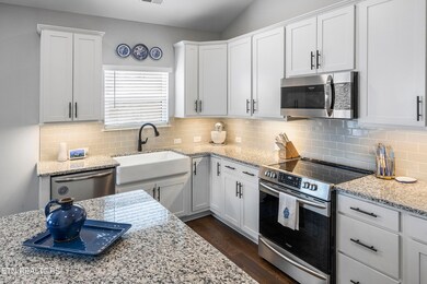 Kitchen with Granite Countertops and Farmhouse Sink