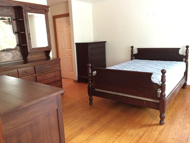 First floor master bedroom with wood floors and private access to full bath