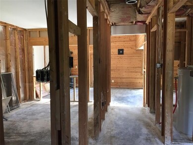 Looking from the front door down the hall to the g