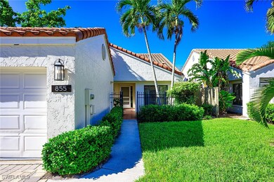 View of front of house with a garage and a front l