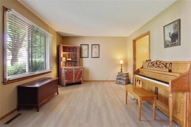 Spacious living room with large windows and new fl