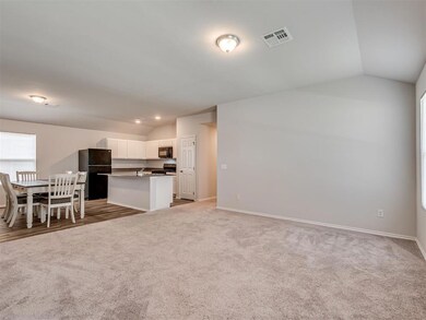 Living, opening to kitchen and dining