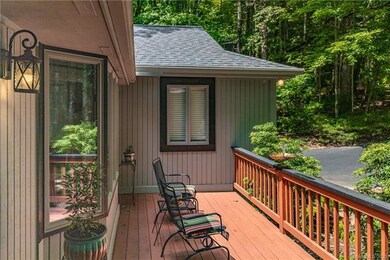 The front deck is sunny and has a babbling fountai