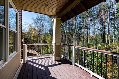 Back deck overlooking wooded lot
