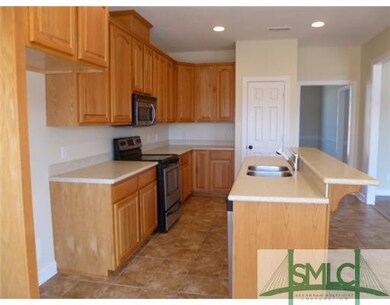 Exterior Front. Kitchen features upgraded countert