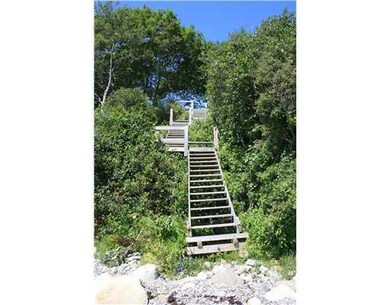 Exterior Front. Walkway to the shore