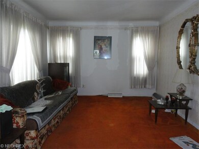 Living room with many newer windows to let in the 