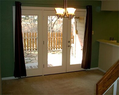 Large dining room with updated light fixture.