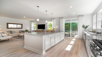 Kitchen with stainless steel range, white cabinets