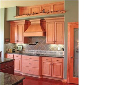 Cooktop wall and walk-in pantry.