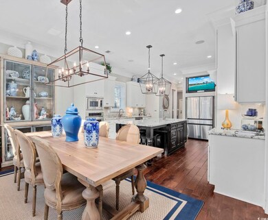 Dining area featuring dark hardwood / wood-style f