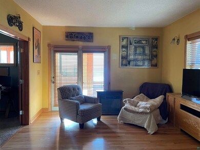 Sitting room with hardwood / wood-style floors, a 