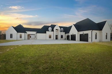 This stunning new construction home has just been 