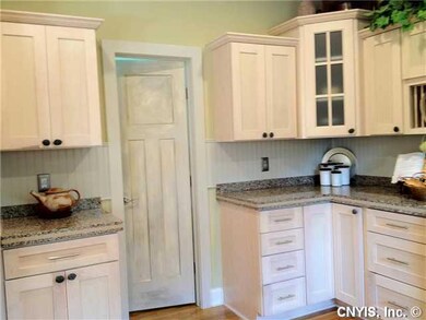 Kitchen. Faux finished pantry door leading to walk